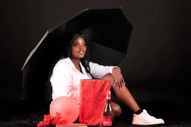 Birthday photo shoot in the studio with an umbrella, balloons and gifts