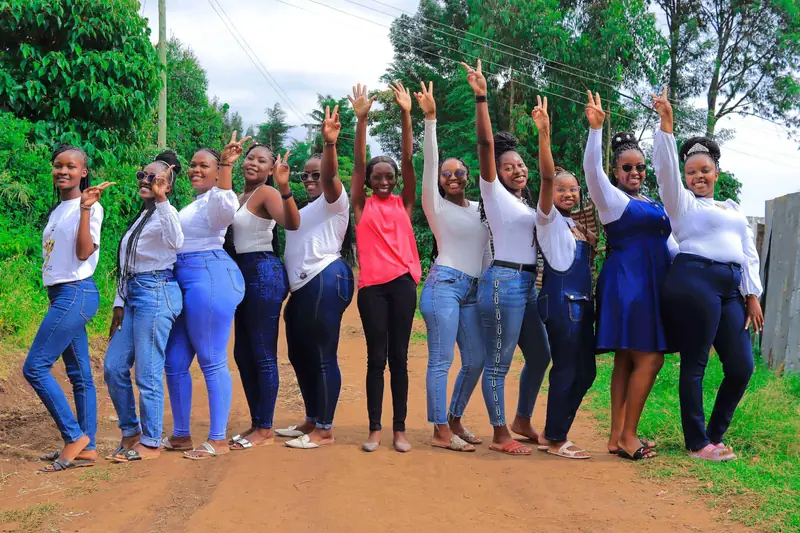Large group of friends celebrating during an outdoor photo shoot